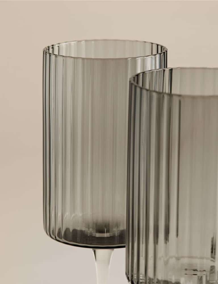 https://asset1.cxnmarksandspencer.com/is/image/mands/Set-of-4-Handmade-Celine-Wine-Glasses/PL_05_T34_9892C_T0_X_EC_1?%24PDP_IMAGEGRID%24=&wid=768&qlt=80