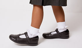 Child walking in new shoes