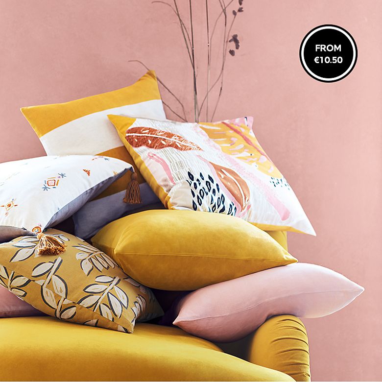 Colourful plain and patterned cushions
