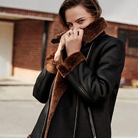 Woman wearing a black aviator jacket