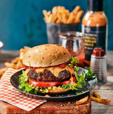 Our Best Ever burger with a bowl of chips and ketchup