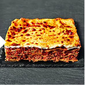 Lasagne al forno on a black slate